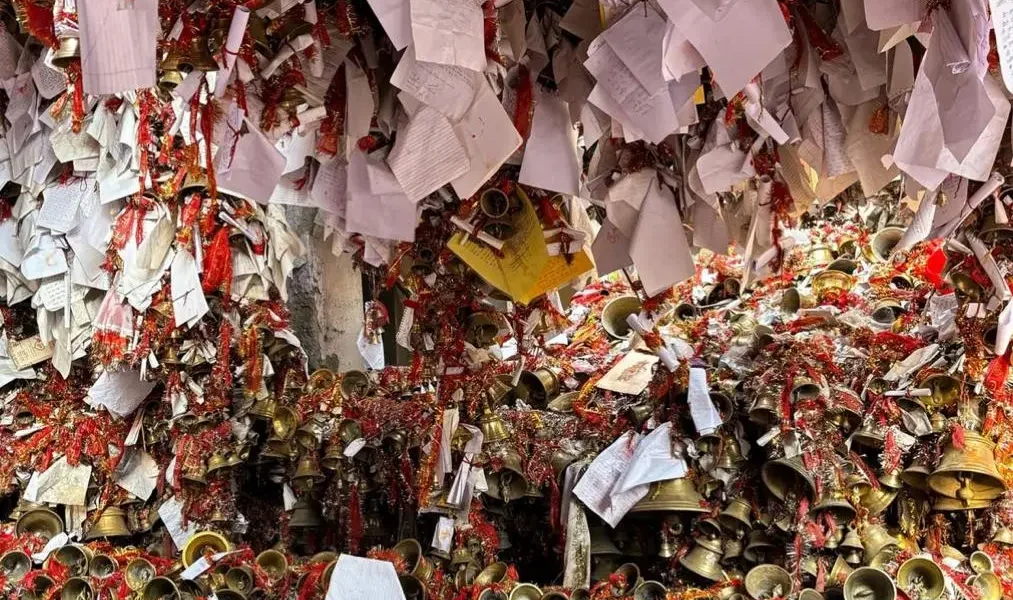 Wishes tied with bells and red threads at Golu Devta temple in Uttarakhand.