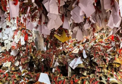 Wishes tied with bells and red threads at Golu Devta temple in Uttarakhand.